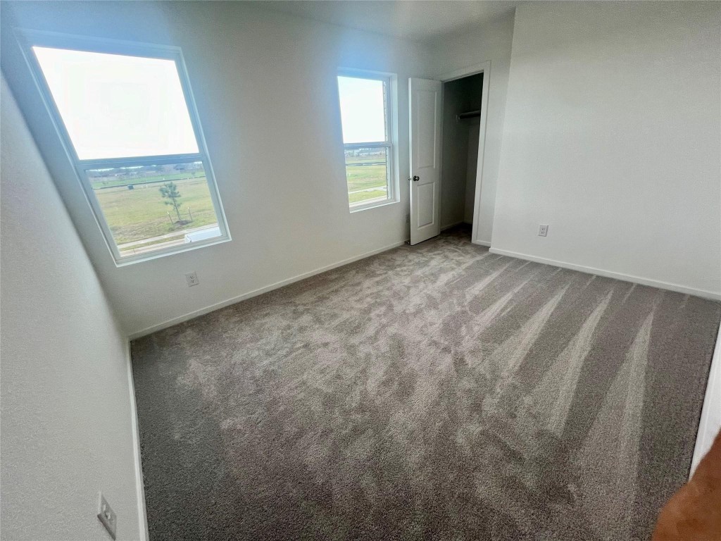 10418 Rocky Trail Beasley, TX 77417 - Photo 8 of 19 an empty room with windows