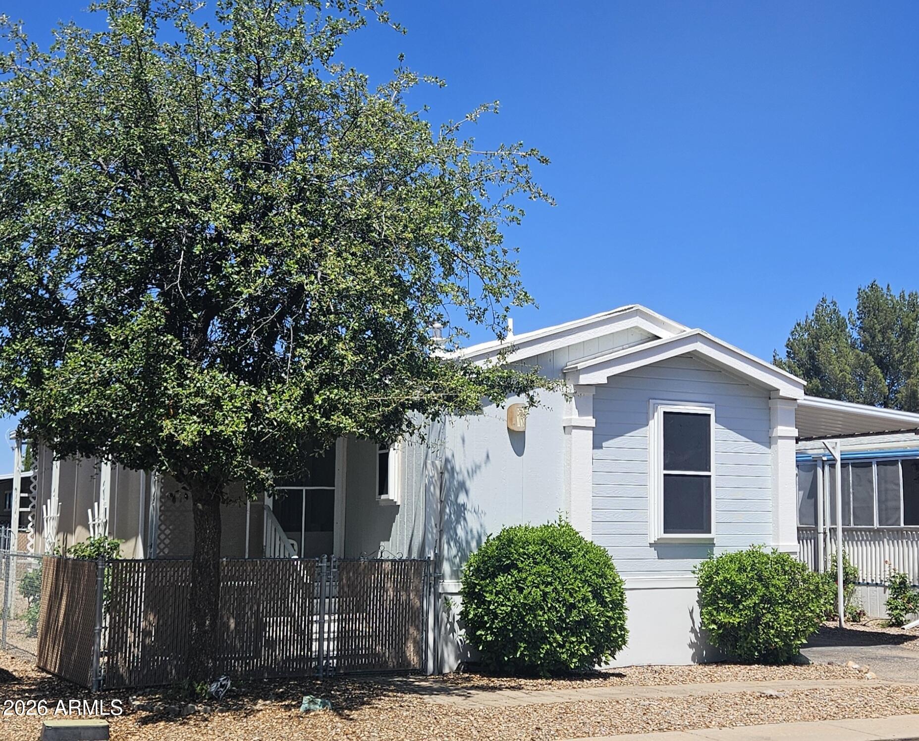 654 Nature Way Sierra Vista, AZ 85635 - Photo 1 of 35 a front view of a house with trees