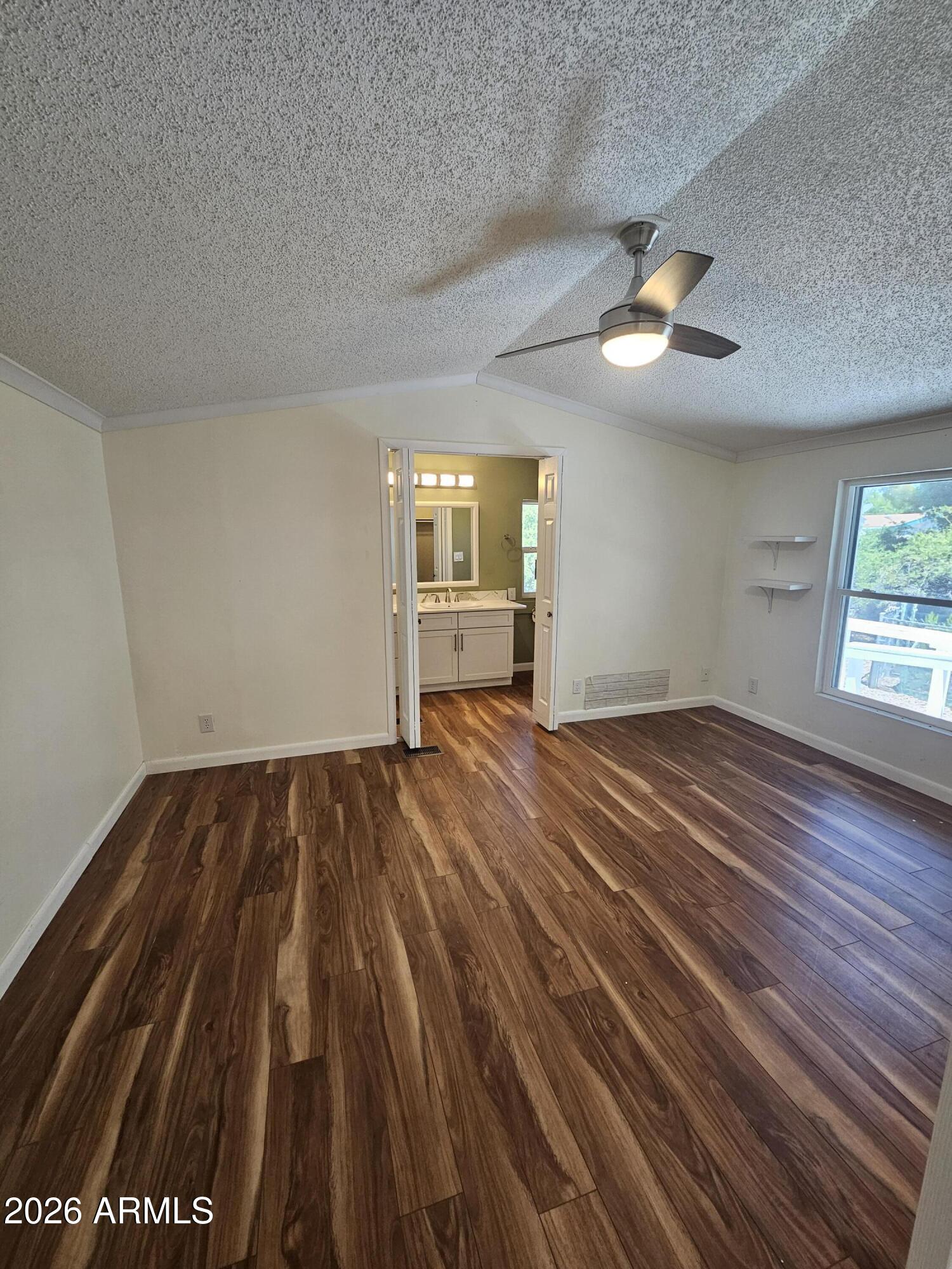 654 Nature Way Sierra Vista, AZ 85635 - Photo 17 of 35 wooden floor in an empty room with a window