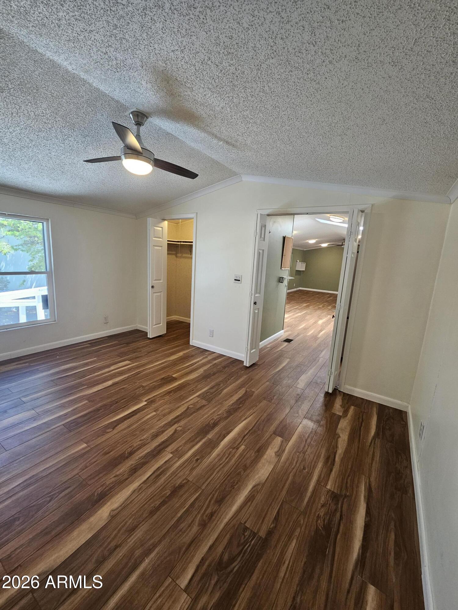 654 Nature Way Sierra Vista, AZ 85635 - Photo 18 of 35 wooden floor in an empty room with a window