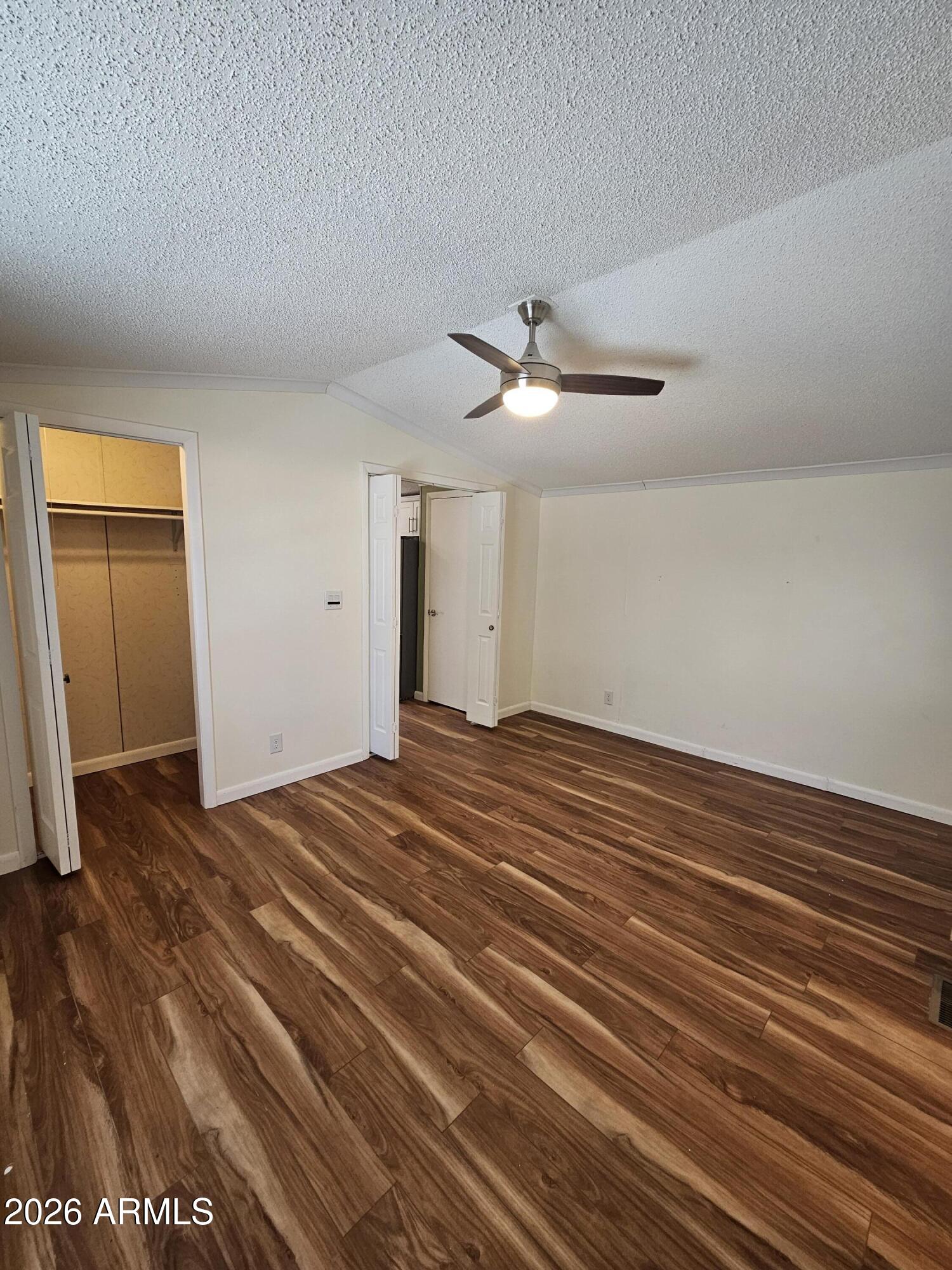 654 Nature Way Sierra Vista, AZ 85635 - Photo 20 of 35 a view of a livingroom with wooden floor and white walls