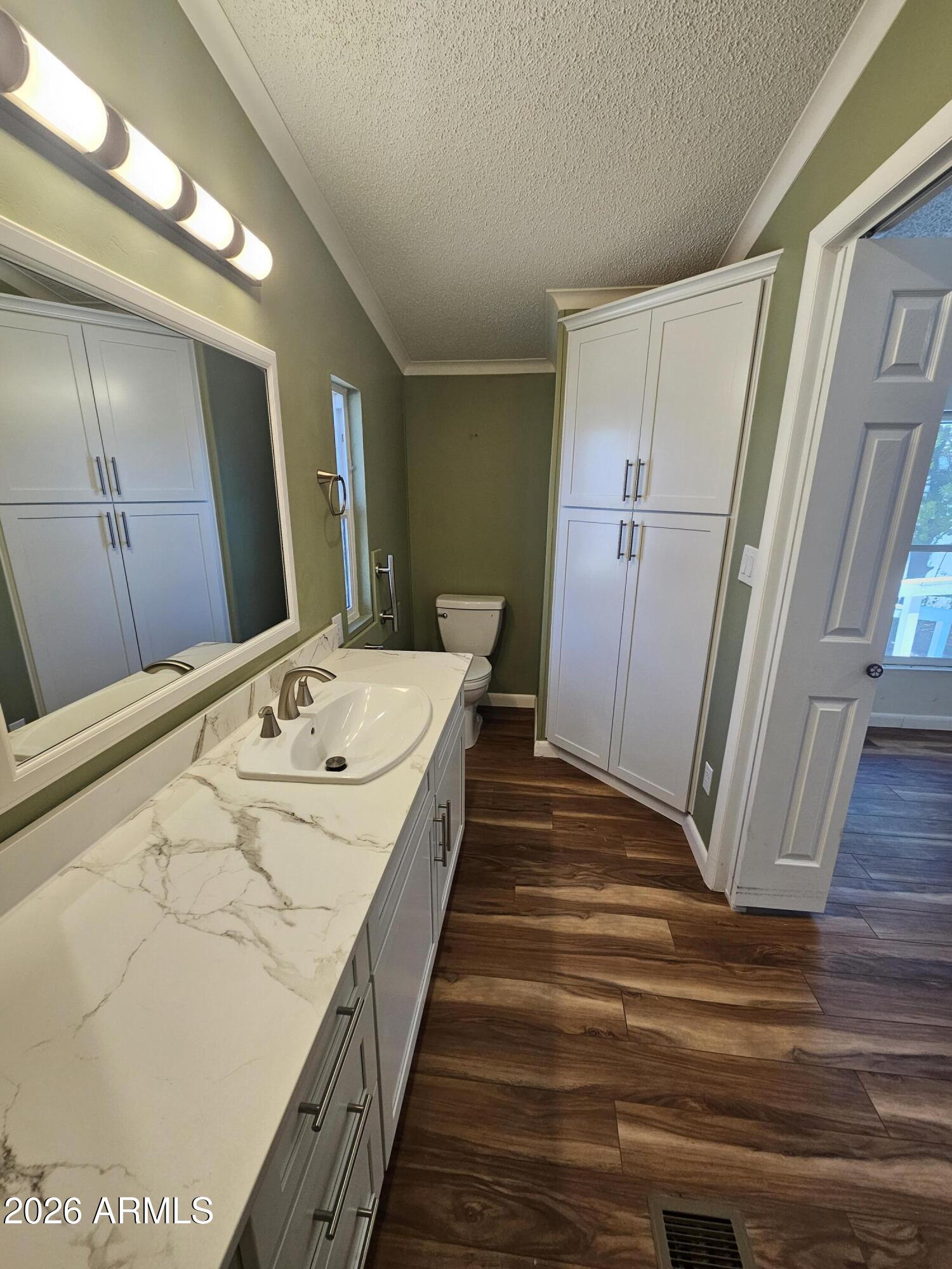 654 Nature Way Sierra Vista, AZ 85635 - Photo 21 of 35 a view of a hallway with wooden floor and staircase