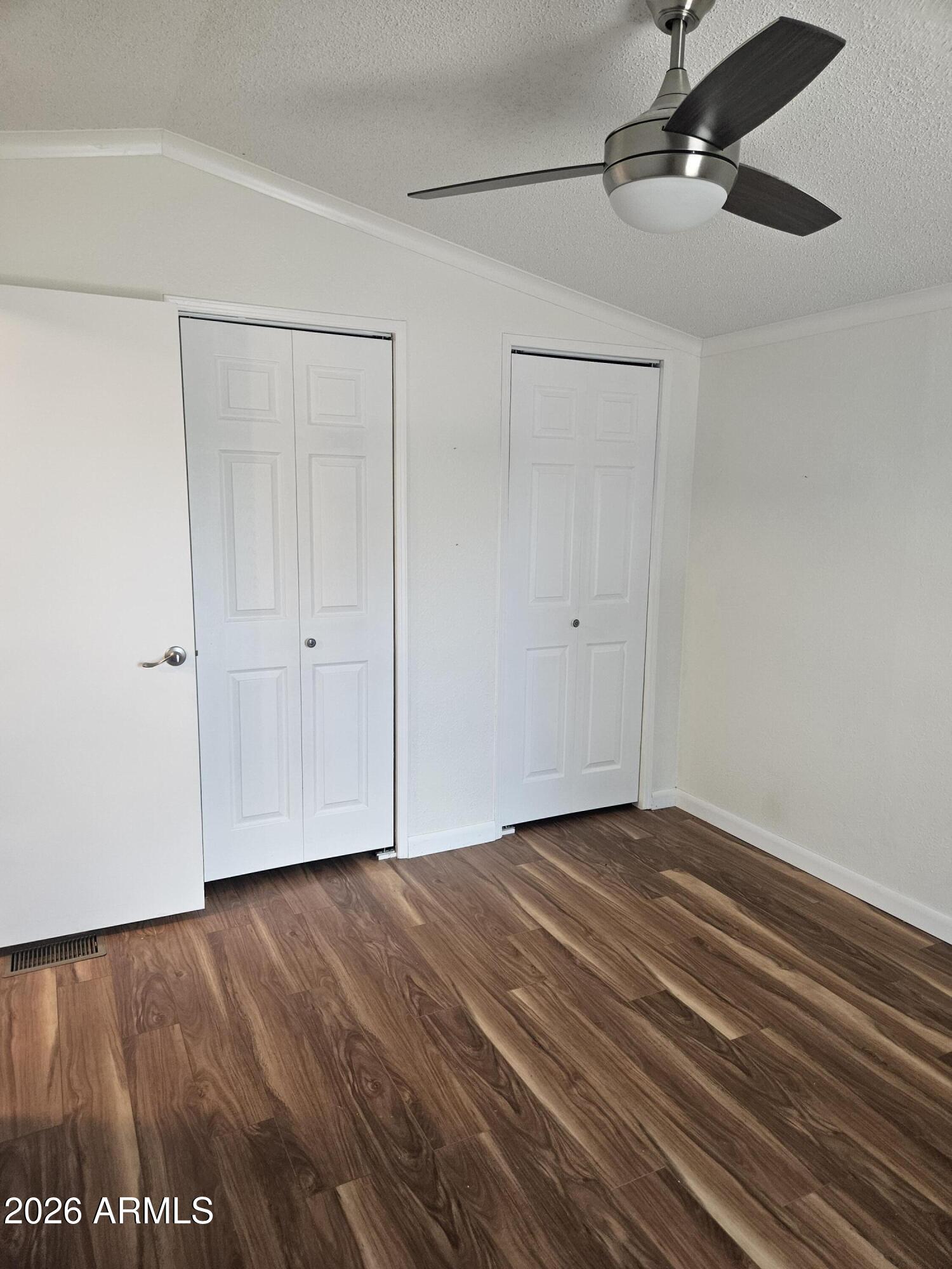 654 Nature Way Sierra Vista, AZ 85635 - Photo 24 of 35 a view of an empty room with wooden floor