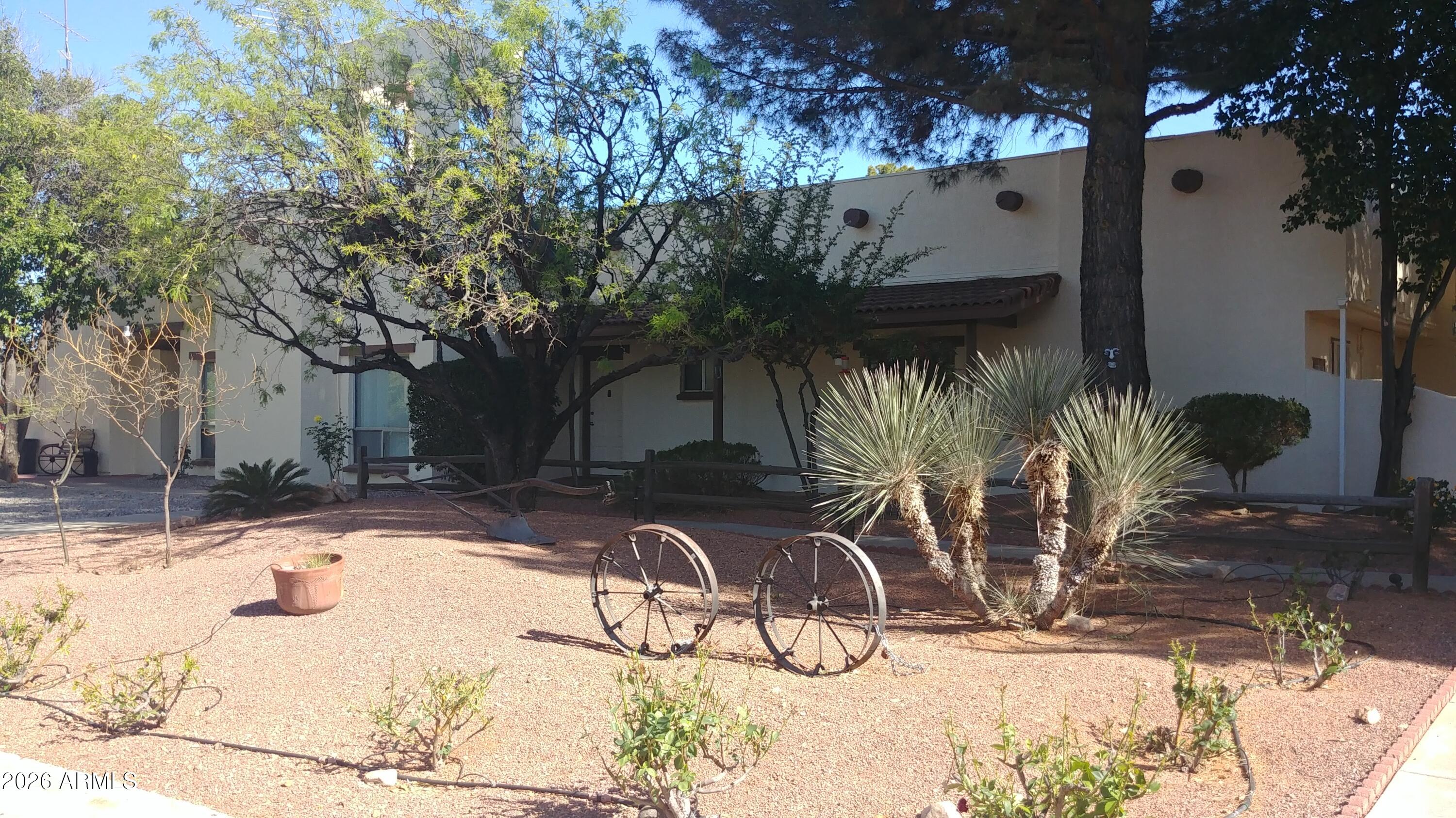654 Nature Way Sierra Vista, AZ 85635 - Photo 31 of 35 a view of a backyard with a tree