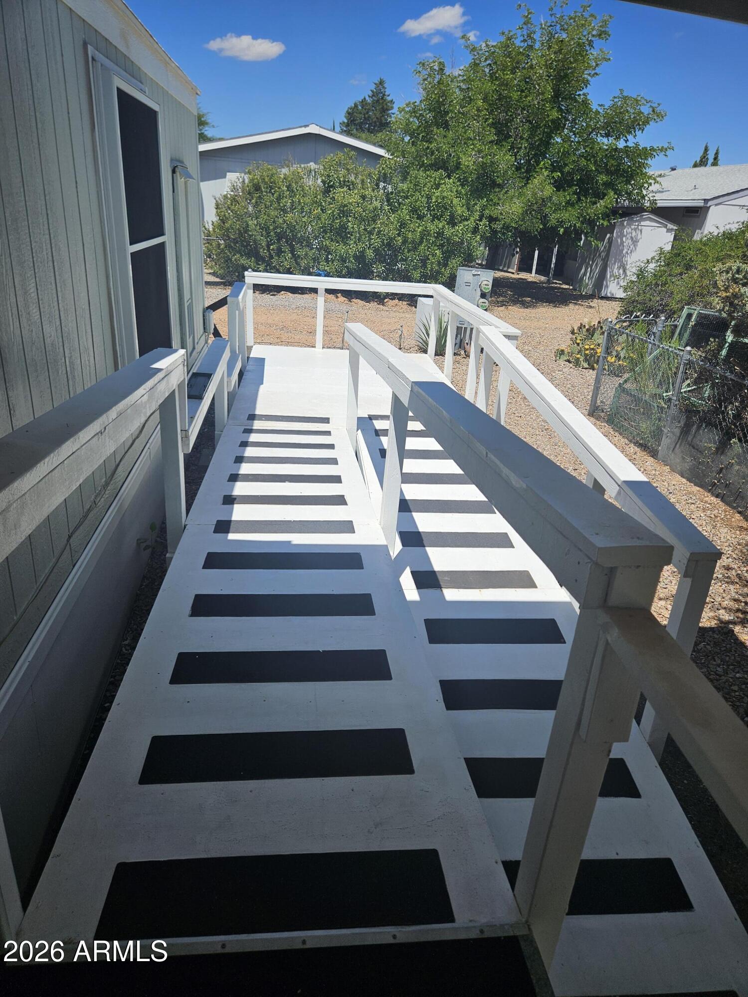 654 Nature Way Sierra Vista, AZ 85635 - Photo 5 of 35 a view of balcony with wooden floor and windows