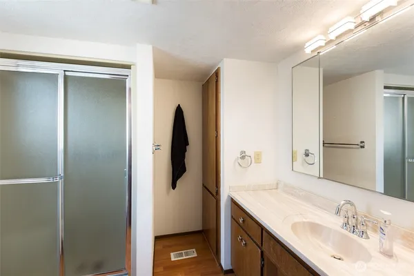 a bathroom with a sink and mirror