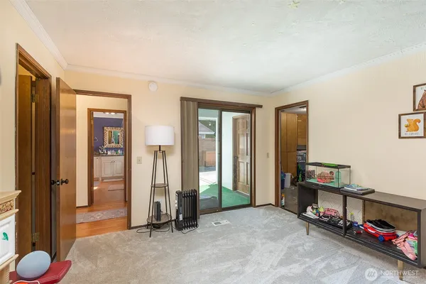 a view of room with floor to ceiling window and a flat screen tv