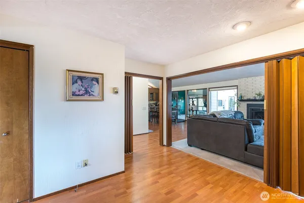 a view of a living room hardwood and a balcony