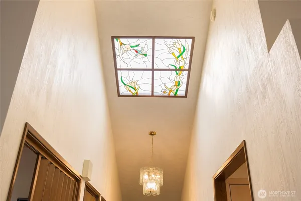 a view of a hallway with windows
