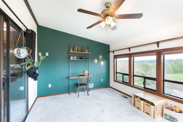 a room with furniture and a large window