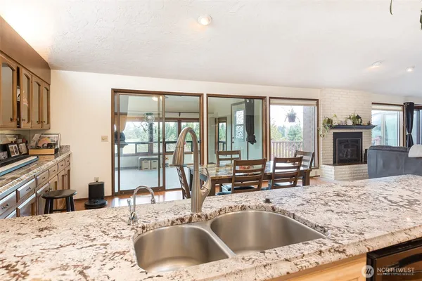 a kitchen with a sink and a large window