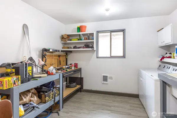 a kitchen with stainless steel appliances a stove a sink and a refrigerator