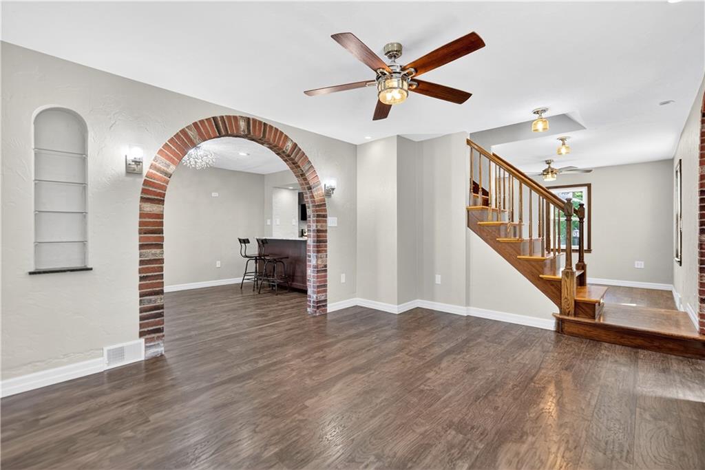 1320 Eckert Road Monaca, PA 15061 - Photo 13 of 30 a view of a livingroom with wooden floor and a ceiling fan