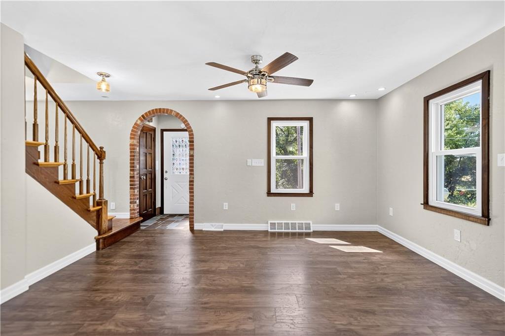 1320 Eckert Road Monaca, PA 15061 - Photo 14 of 30 an empty room with wooden floor chandelier and windows
