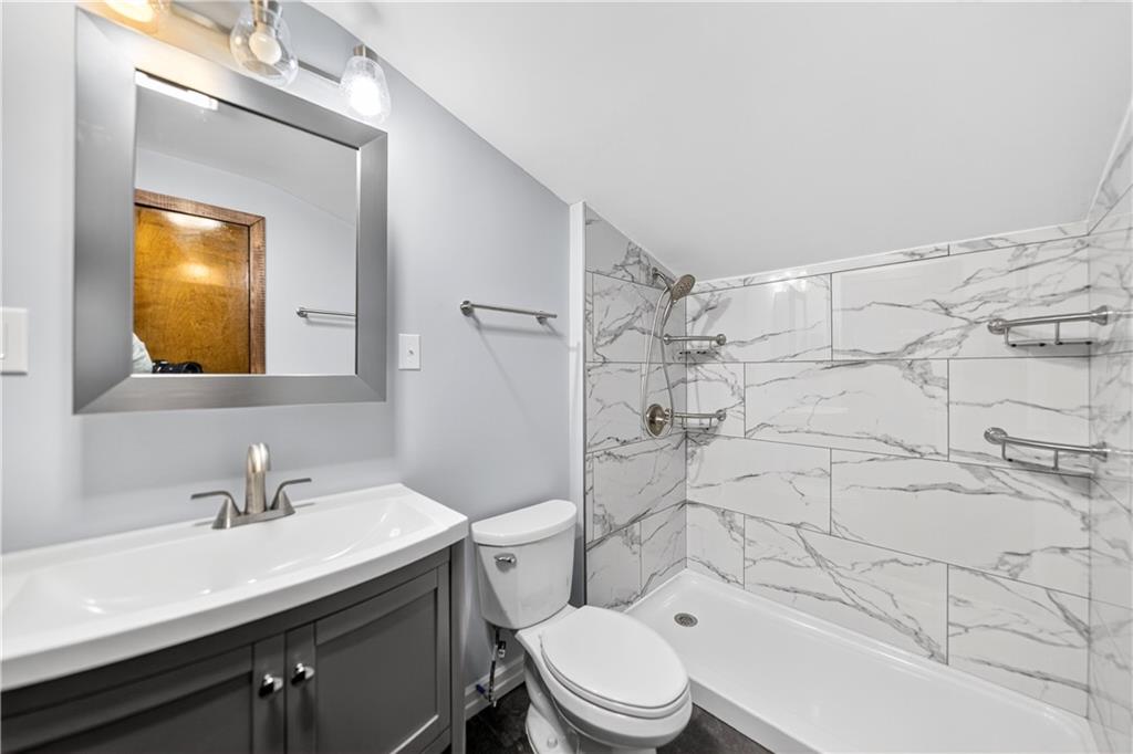 1320 Eckert Road Monaca, PA 15061 - Photo 17 of 30 a bathroom with a sink mirror vanity and toilet