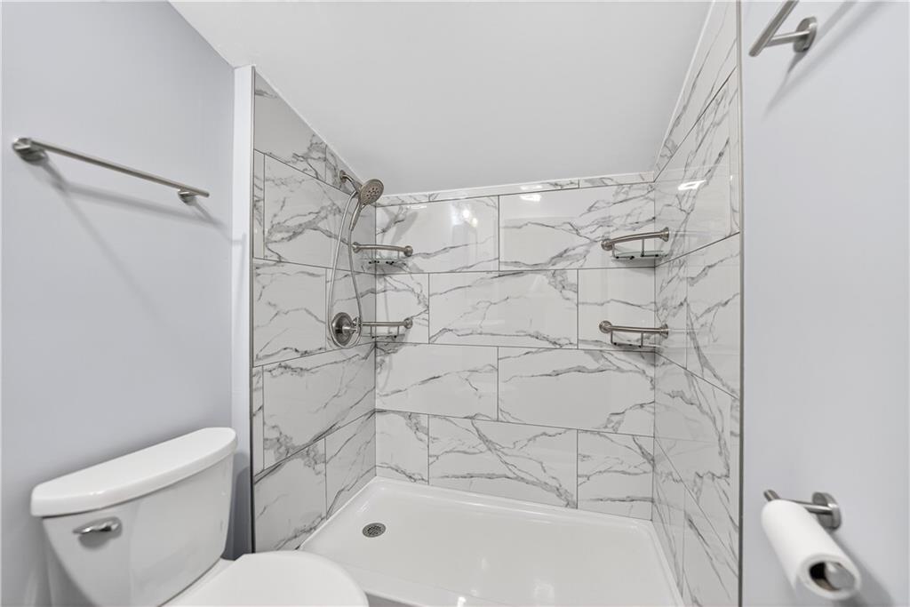 1320 Eckert Road Monaca, PA 15061 - Photo 18 of 30 a bathroom with a toilet and a bathtub