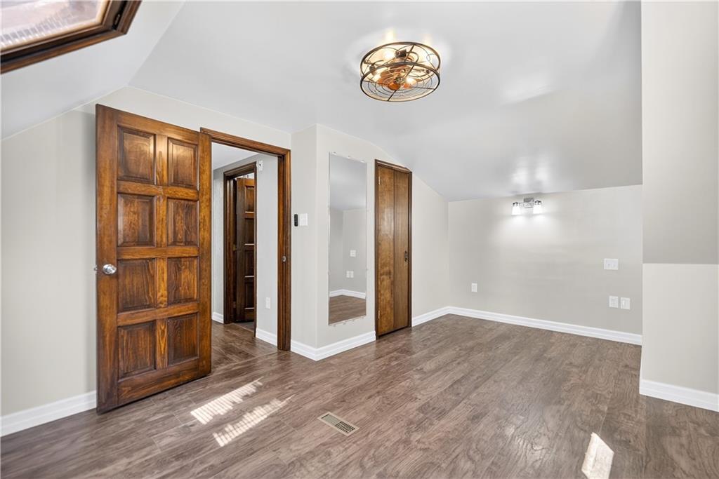 1320 Eckert Road Monaca, PA 15061 - Photo 20 of 30 an empty room with wooden floor and windows