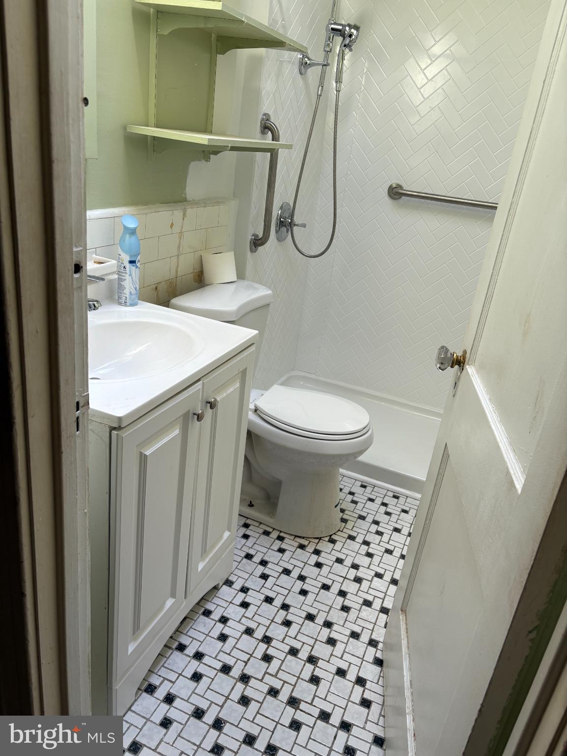 7837 Provident Street Philadelphia, PA 19150 - Photo 16 of 26 a bathroom with a sink a toilet and shower