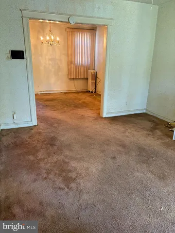 a view of a livingroom with a windows & cabinet