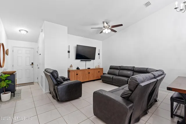 a view of a house with a backyard porch and sitting area
