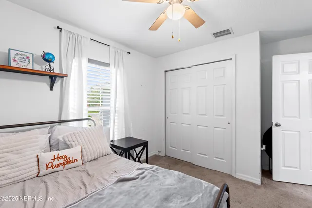 an aerial view of house with yard swimming pool and outdoor seating