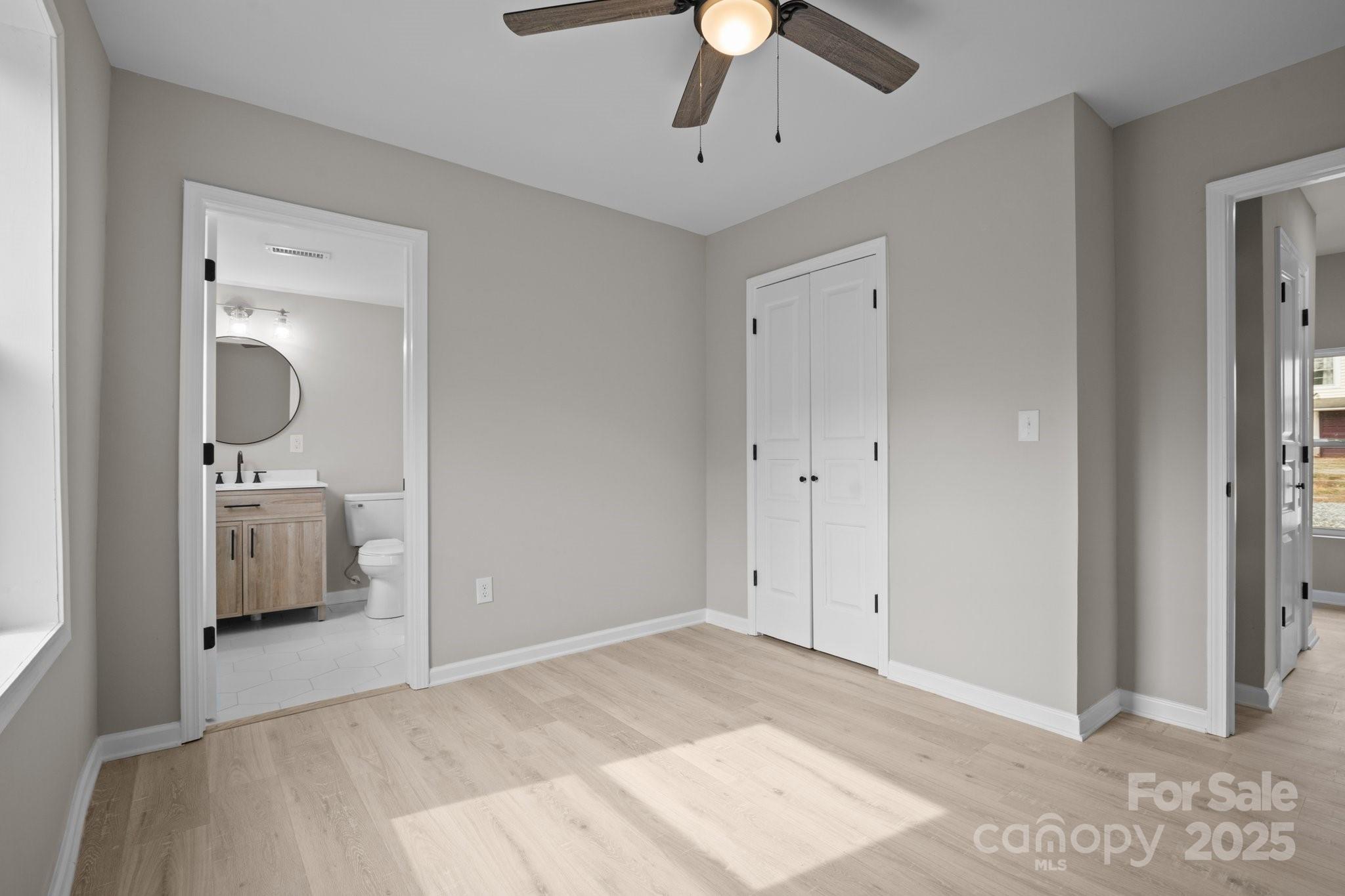 937 Gladstone Road Mocksville, NC 27028 - Photo 21 of 34 a view of a bedroom with a sink and a bed