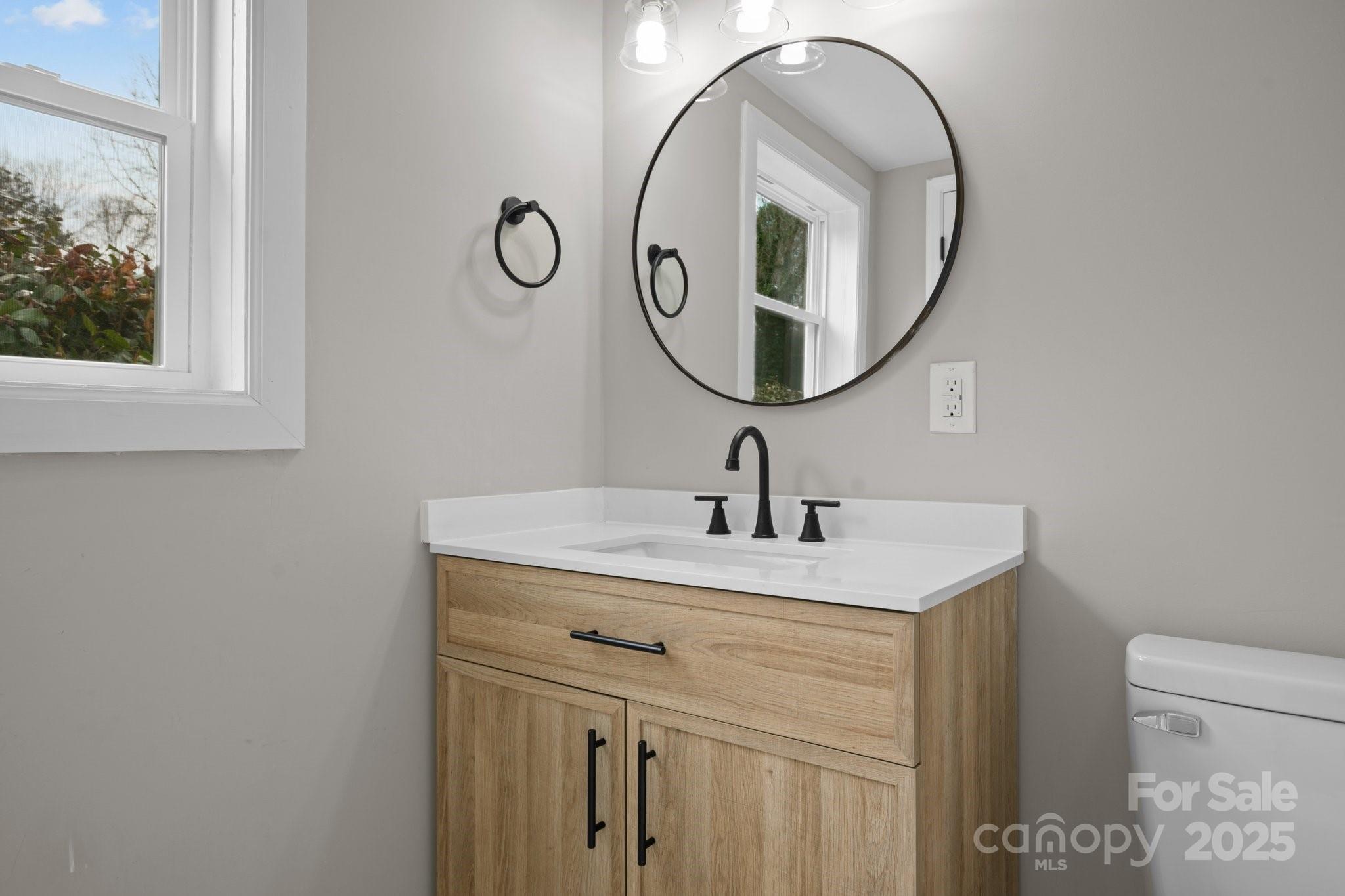 937 Gladstone Road Mocksville, NC 27028 - Photo 24 of 34 a bathroom with a sink and a mirror