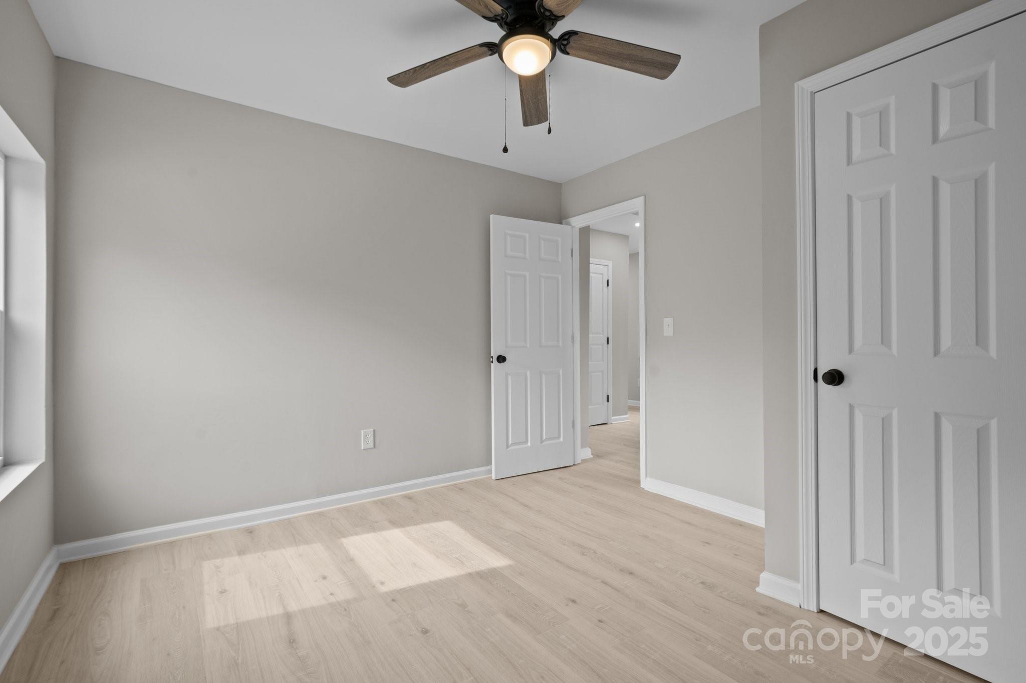937 Gladstone Road Mocksville, NC 27028 - Photo 30 of 34 a view of an empty room and chandelier fan