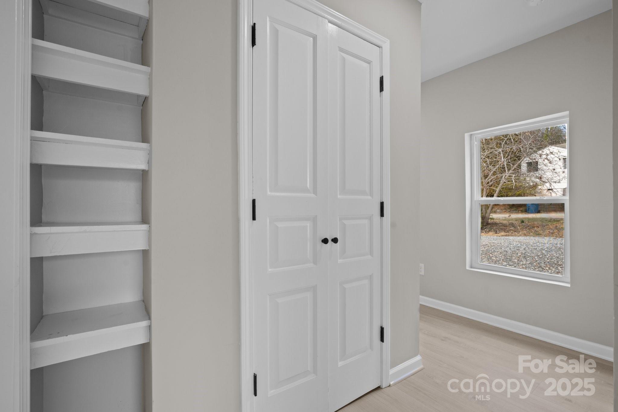 937 Gladstone Road Mocksville, NC 27028 - Photo 31 of 34 a view of an empty room with window and closet area