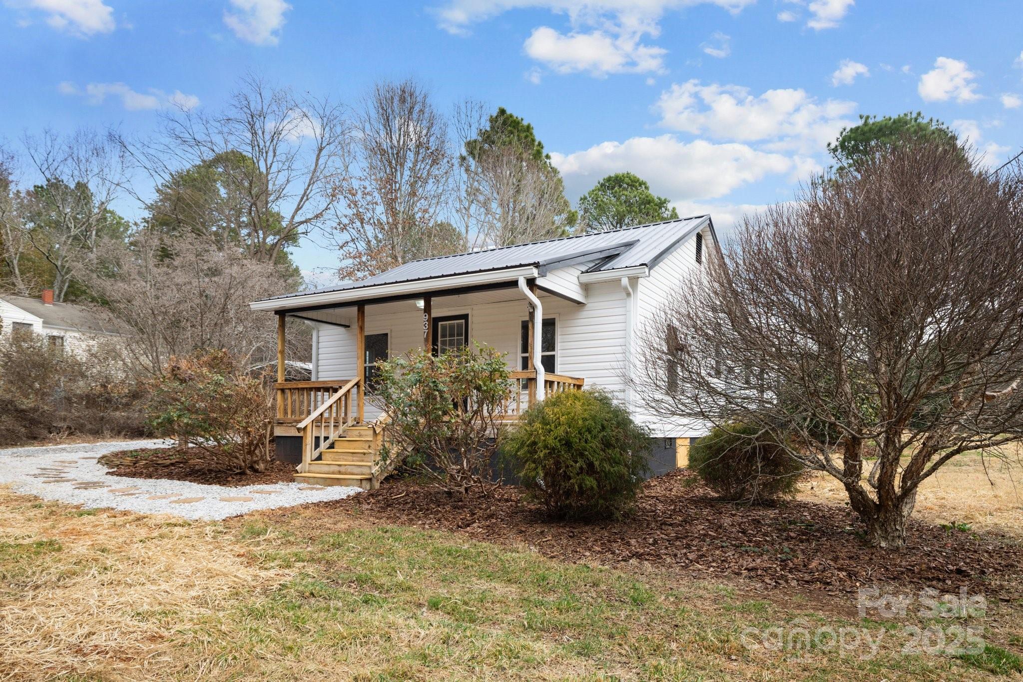 937 Gladstone Road Mocksville, NC 27028 - Photo 32 of 34 a view of a house with a yard
