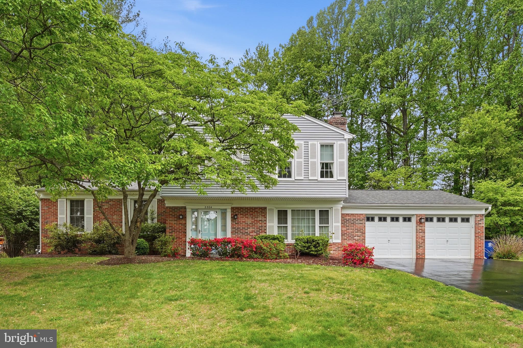2304 Hidden Valley Lane Silver Spring, MD 20904 - Photo 1 of 54 a front view of house with yard and green space