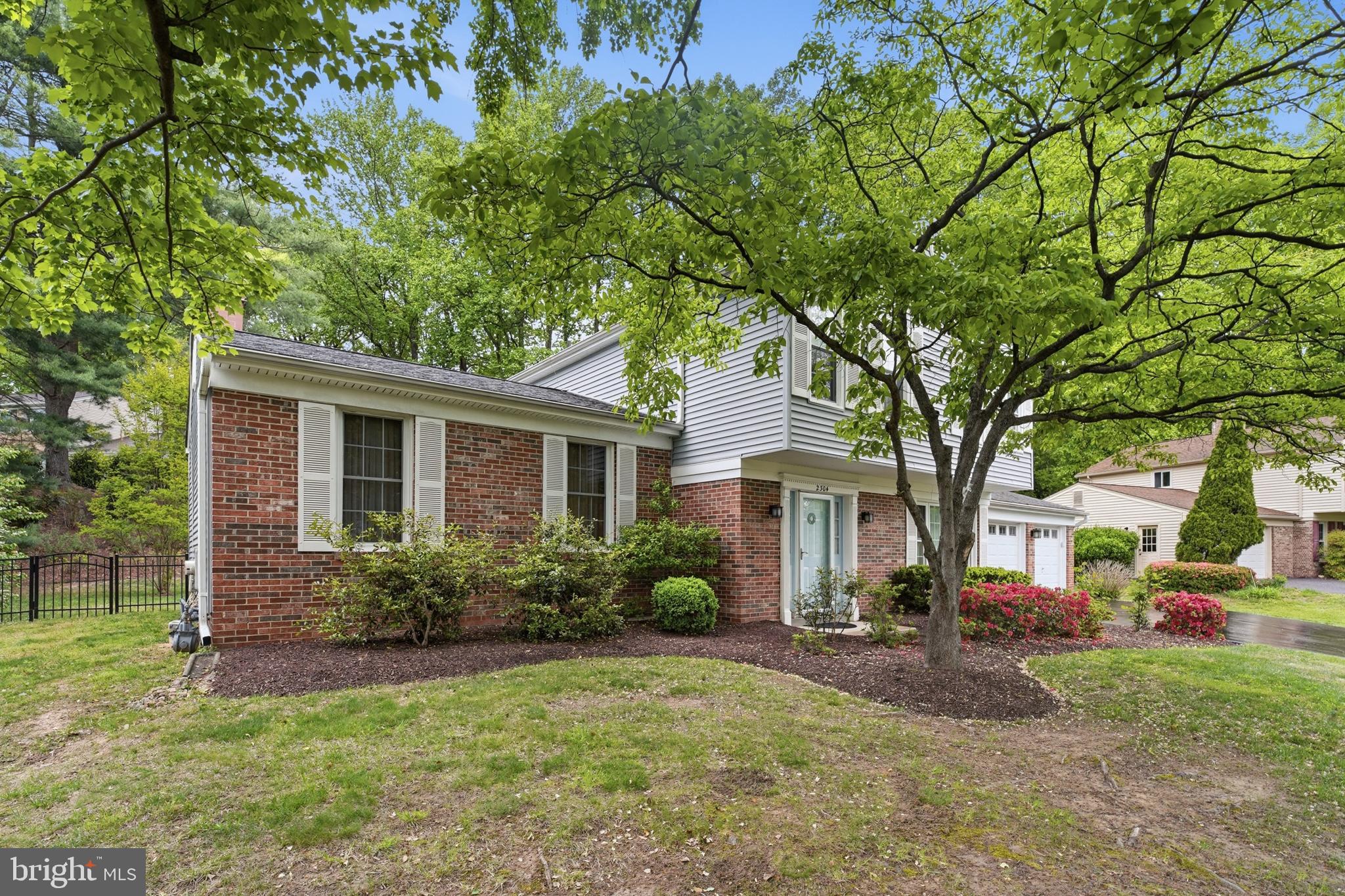 2304 Hidden Valley Lane Silver Spring, MD 20904 - Photo 2 of 54 a front view of a house with garden