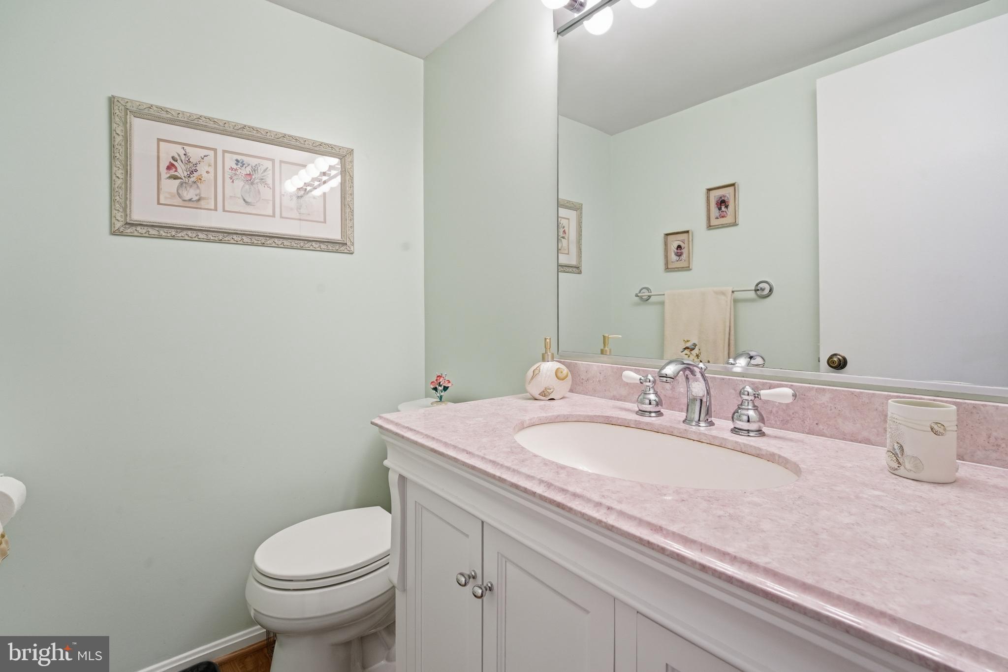 2304 Hidden Valley Lane Silver Spring, MD 20904 - Photo 21 of 54 a bathroom with a granite countertop sink mirror vanity and toilet