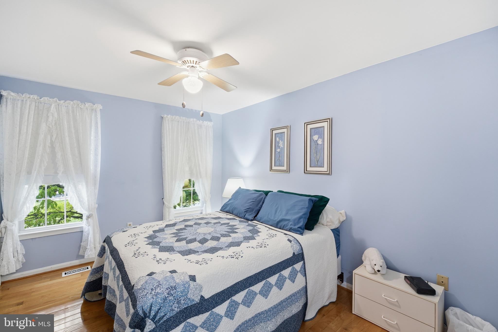 2304 Hidden Valley Lane Silver Spring, MD 20904 - Photo 24 of 54 a bedroom with a bed and a window