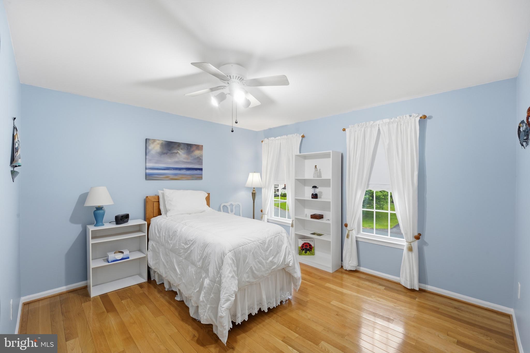 2304 Hidden Valley Lane Silver Spring, MD 20904 - Photo 25 of 54 a bedroom with a bed and a chandelier