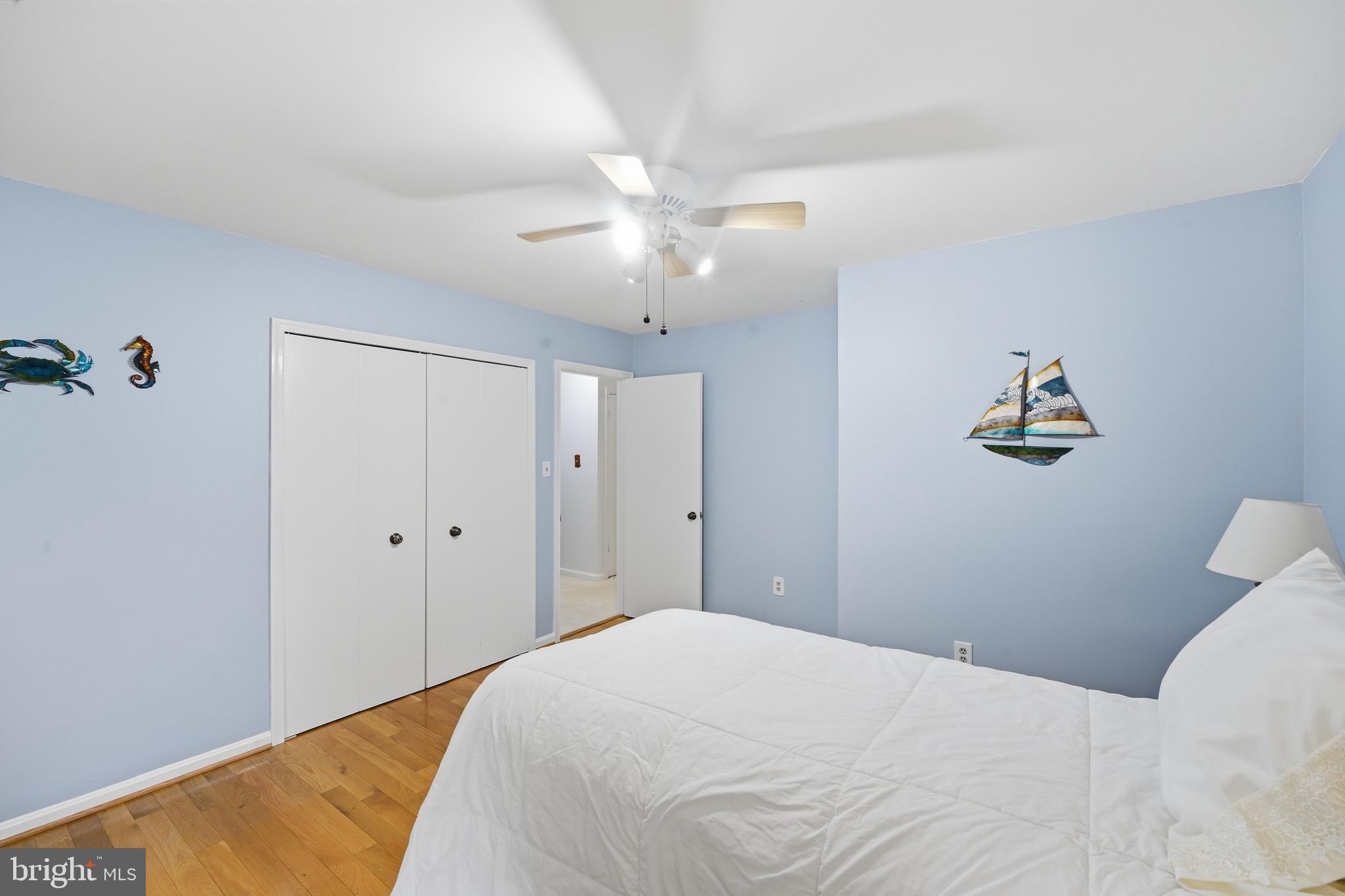 2304 Hidden Valley Lane Silver Spring, MD 20904 - Photo 27 of 54 a bedroom with a bed and a chandelier