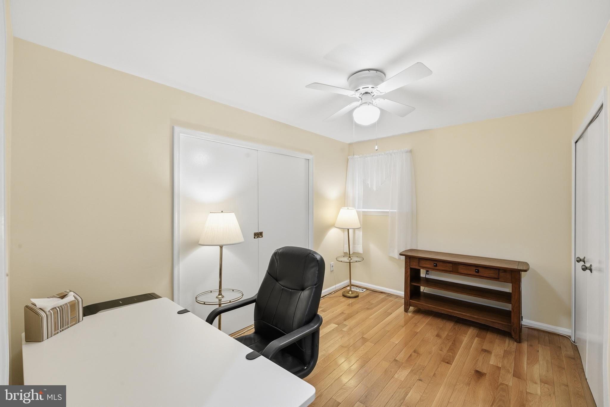 2304 Hidden Valley Lane Silver Spring, MD 20904 - Photo 28 of 54 a bedroom with furniture and a wooden floor
