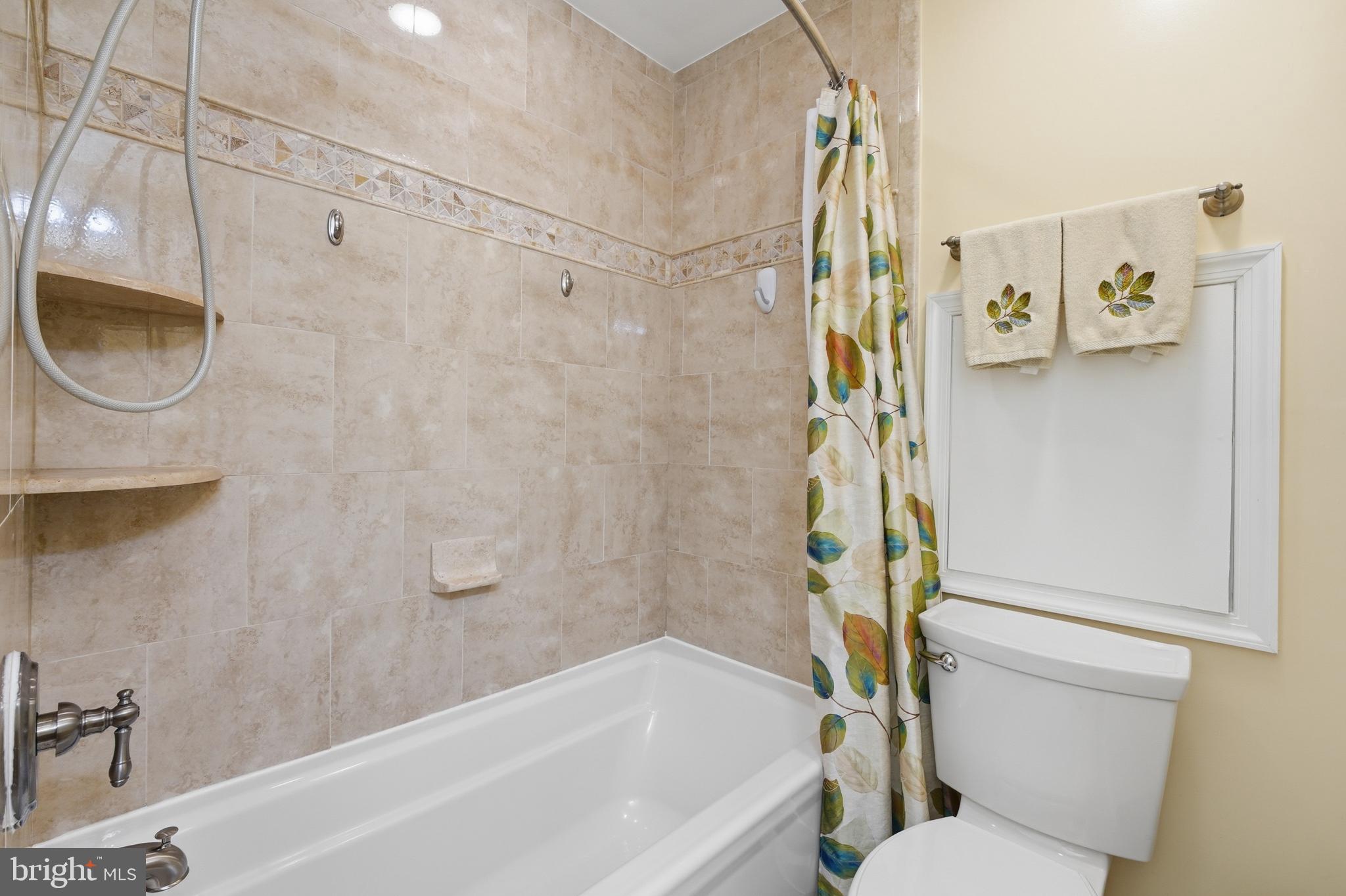 2304 Hidden Valley Lane Silver Spring, MD 20904 - Photo 30 of 54 a bathroom with a shower a toilet and a sink