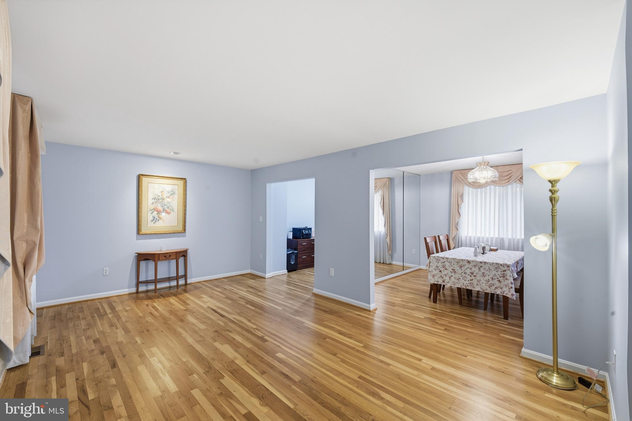 2304 Hidden Valley Lane Silver Spring, MD 20904 - Photo 4 of 54 a bedroom with a bed and wooden floor