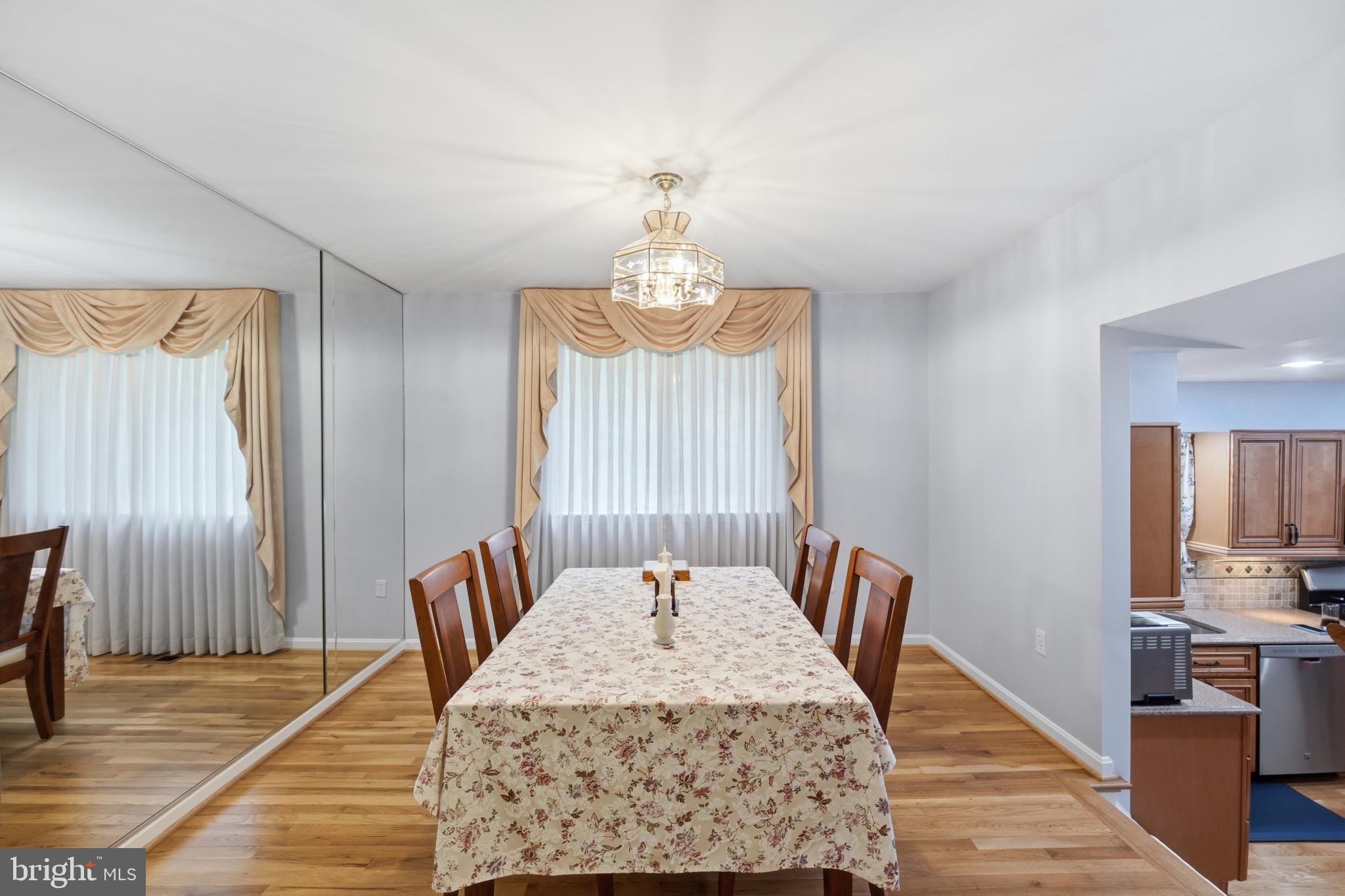 2304 Hidden Valley Lane Silver Spring, MD 20904 - Photo 6 of 54 a dining room with a table chairs and a chandelier