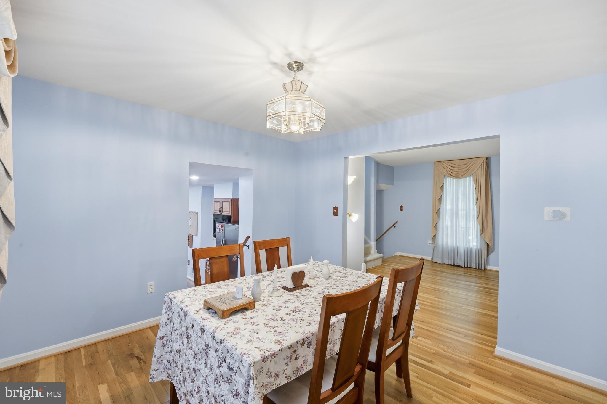 2304 Hidden Valley Lane Silver Spring, MD 20904 - Photo 7 of 54 a view of a dining room with furniture and wooden floor