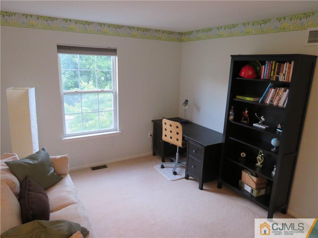 125 Castleton Road Princeton, NJ 08540 - Photo 14 of 24 a living room with furniture and a window