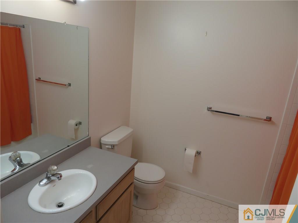 125 Castleton Road Princeton, NJ 08540 - Photo 18 of 24 a bathroom with a sink toilet and a mirror