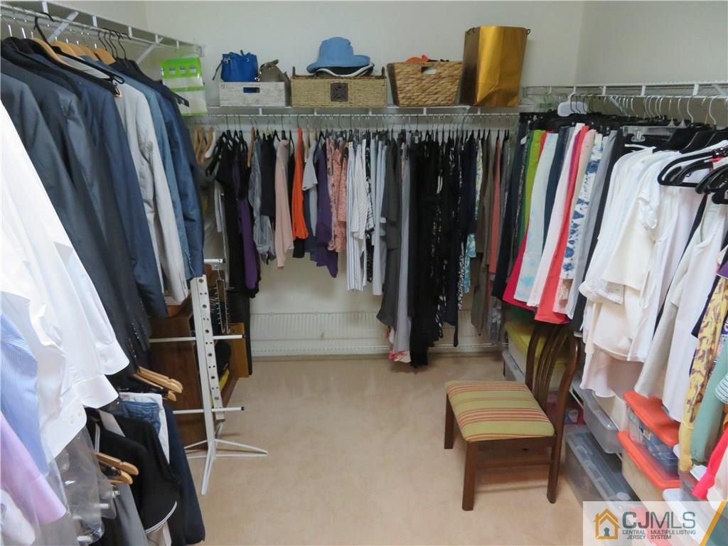 125 Castleton Road Princeton, NJ 08540 - Photo 22 of 24 a view of walk in closet with clothes and shoes