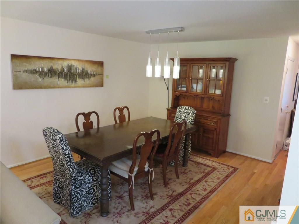 125 Castleton Road Princeton, NJ 08540 - Photo 4 of 24 a dining room with furniture and wooden floor