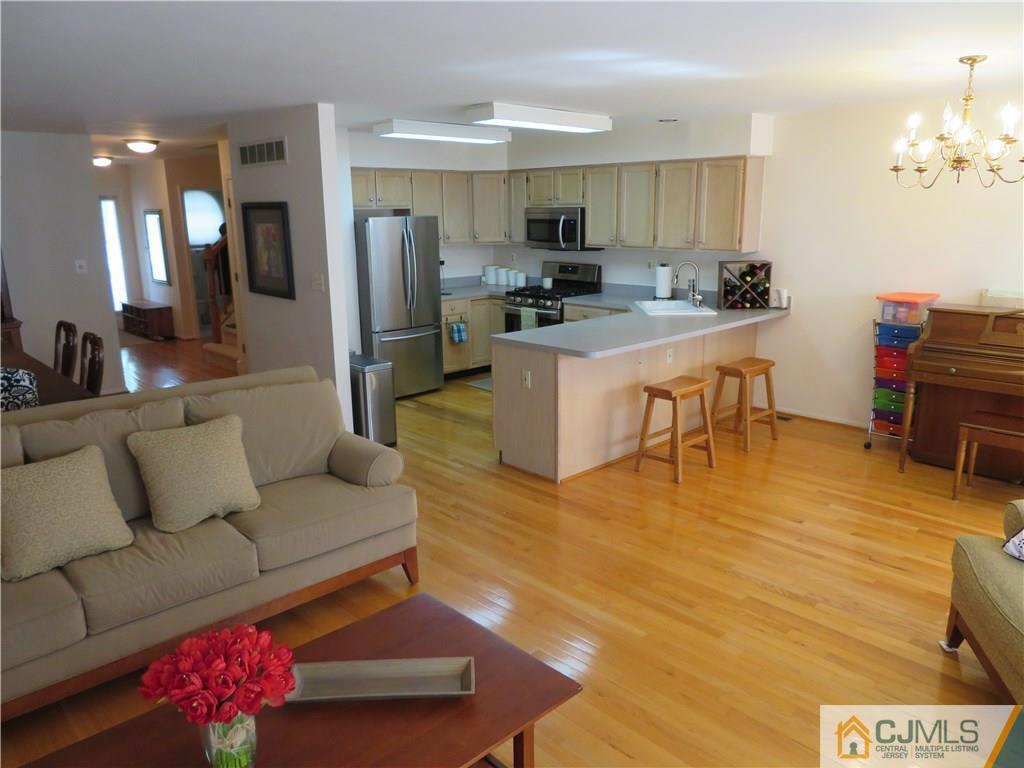 125 Castleton Road Princeton, NJ 08540 - Photo 8 of 24 a living room with furniture and kitchen view