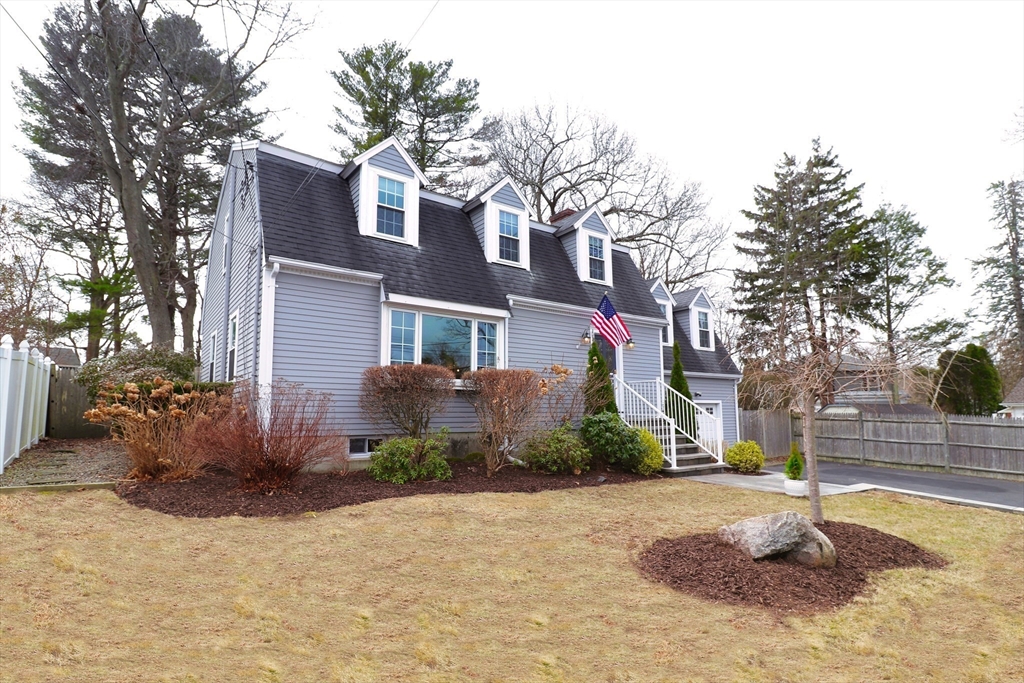 341 Reedsdale Road Milton, MA 02186 - Photo 2 of 28 a front view of a house with a yard
