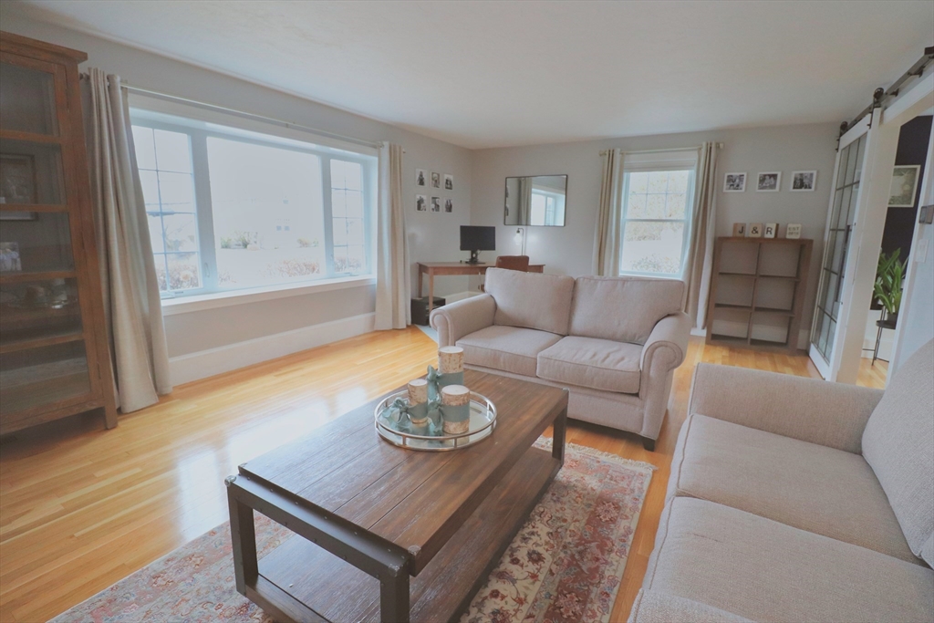 341 Reedsdale Road Milton, MA 02186 - Photo 5 of 28 a living room with furniture and a wooden floor