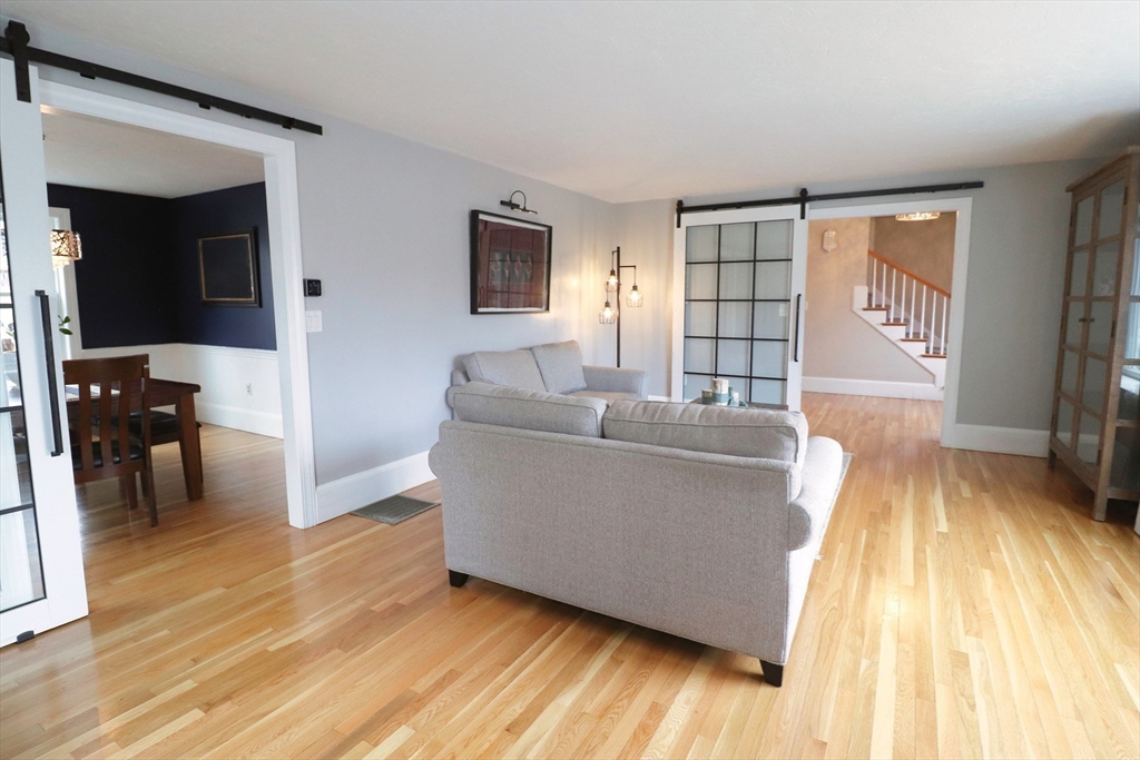 341 Reedsdale Road Milton, MA 02186 - Photo 6 of 28 a living room with furniture and a wooden floor