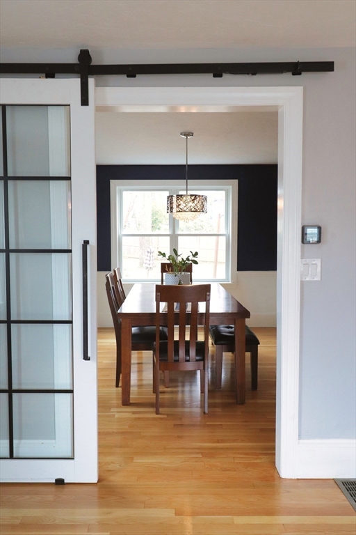 341 Reedsdale Road Milton, MA 02186 - Photo 7 of 28 a view of a dining area with furniture and wooden floor